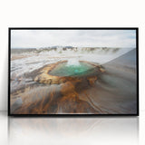 Large abstract wall art featuring serene Icelandic scenery in muted blue and gray tones, framed in black acrylic.