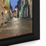 Close-up of a textured black wall art depicting a colorful Irish landscape on a framed canvas, ideal for living room decor.