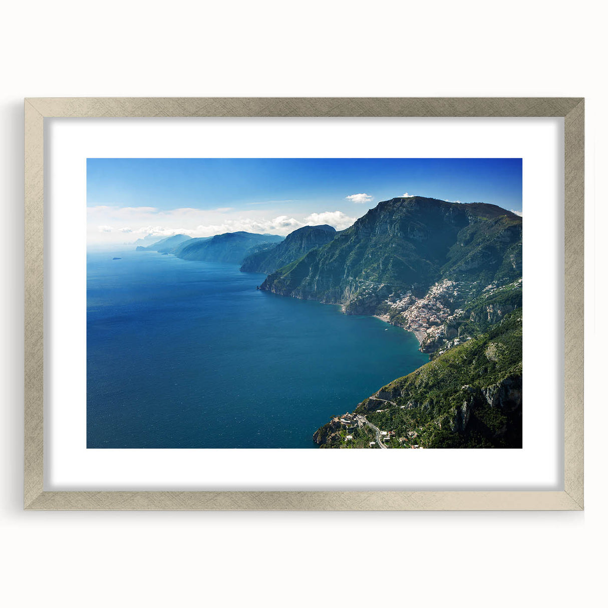 Abstract art print of the Amalfi Coast with vibrant blue and white tones, framed in silver, ideal for dining room decor.