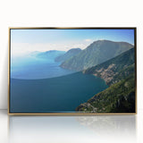 Framed acrylic print of the Amalfi Coast with vibrant blue and green tones, in an art deco style.