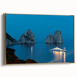 Framed canvas featuring a vintage-style landscape painting of Capri, Italy, with muted gold and black tones.