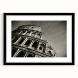 Extra large framed wall art of an abstract, colorful depiction of the Colosseum in Italy, ideal for living room decor.
