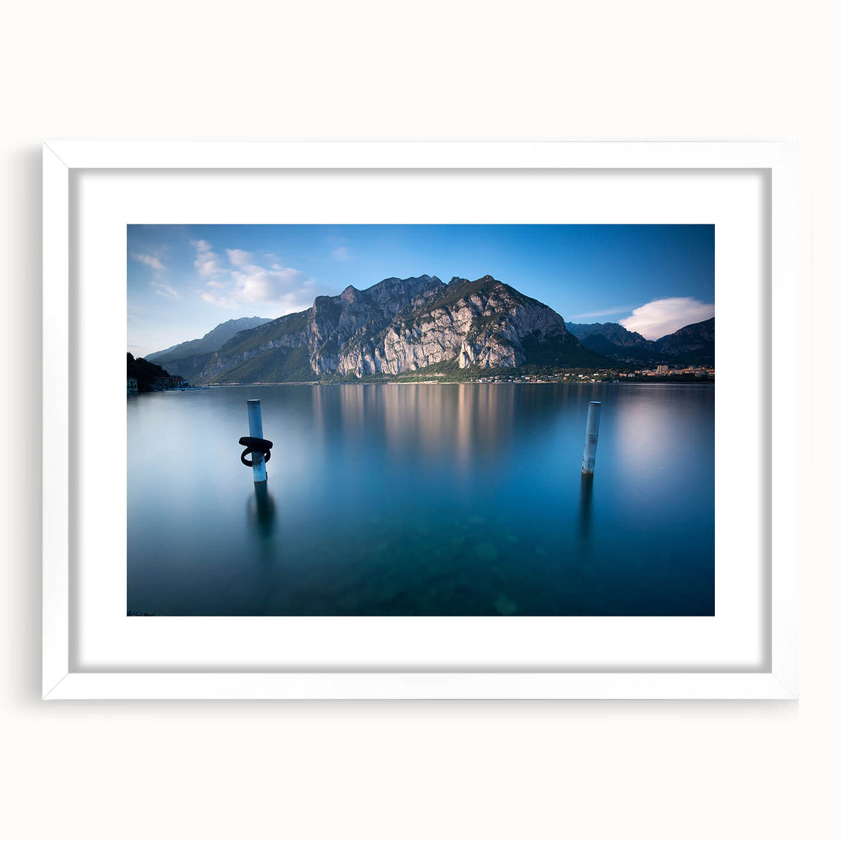 Textured art of Lake Como with abstract elements in muted blue and green shades, framed with a white mat.