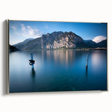 Framed canvas depicting a vintage-style Lake Como landscape, with muted blues and greens, ideal for living room decor.