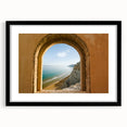Colorful abstract art print of a Sicilian landscape, in a black frame with a mat, ideal for living room decor.