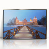 Large art print of a European Lithuanian landscape in muted green and blue tones, framed in silver acrylic.