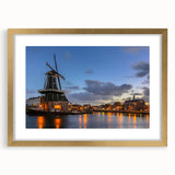 Abstract art print of Amsterdam skyline in muted gold and blue tones on a framed canvas, suitable for dining room decor.
