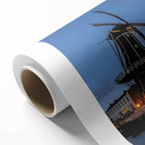 Art deco poster of Amsterdam scenery on rolled canvas, featuring muted earth tones, ideal for nursery wall art.