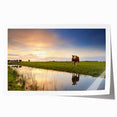 European countryside scene with vibrant green fields and a windmill, printed on a large rolled canvas.