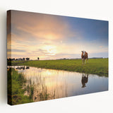 Side view of a stretched canvas depicting a serene Netherlands landscape in muted green and blue tones.