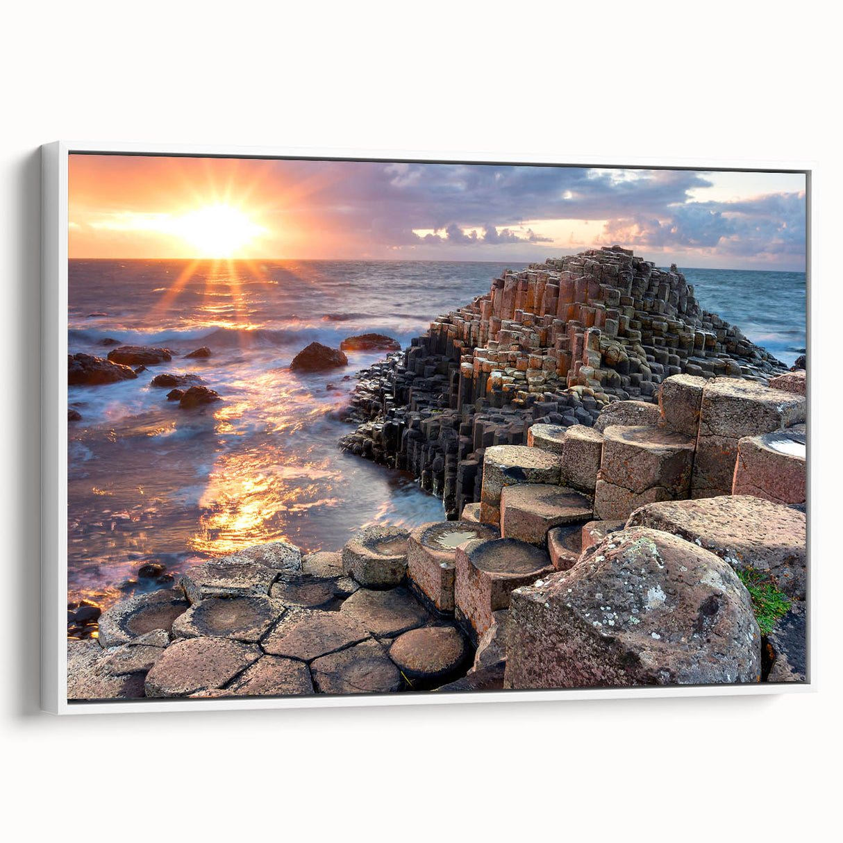 Framed canvas of a vintage poster depicting the Northern Ireland coastline in muted green and blue tones.