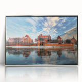 Large art print of a European landscape in muted green and blue tones on a silver-framed acrylic.