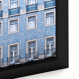 Black wall art featuring a textured, colorful Lisbon scenery on a framed canvas, ideal for living room decor.