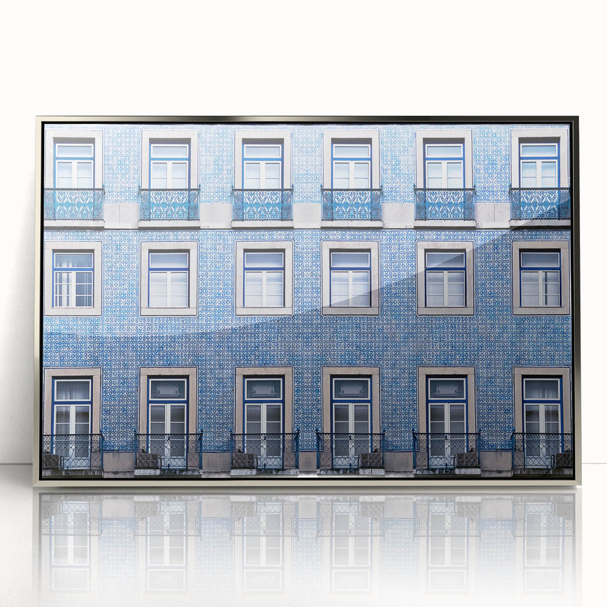 Mid-century modernist art depicting Lisbon scenery in muted earth tones on a silver-framed acrylic print.