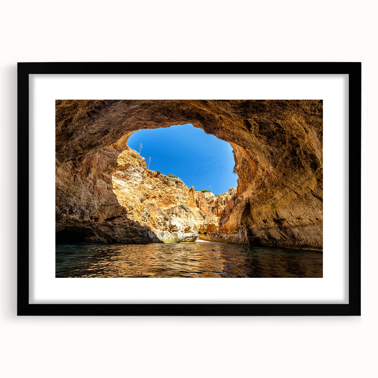 Abstract art print of a colorful European scenery in vibrant hues on a large, textured canvas, framed in black.