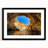 Abstract art print of a colorful European scenery in vibrant hues on a large, textured canvas, framed in black.