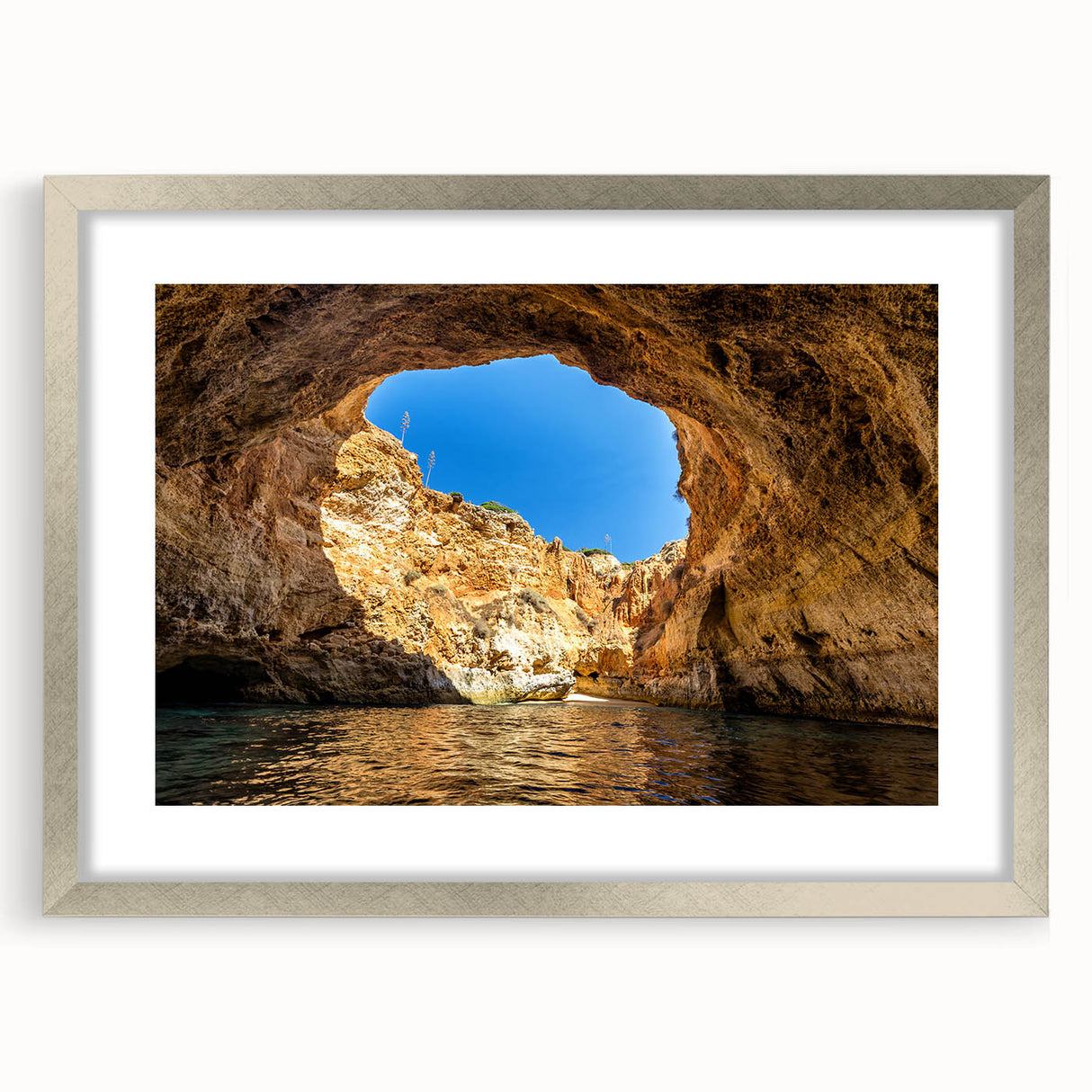 Extra large abstract art print depicting a textured European scenery in muted earth tones, framed with a silver mat.