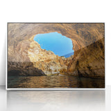 Mid-century modernist art depicting a European coastal town in muted blue and white tones on a framed acrylic.