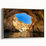 Framed canvas featuring a vintage-style landscape painting of a European coastal scene in colorful hues.