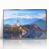 Acrylic print of a scenic Slovenian landscape in muted green and blue tones, framed in silver.