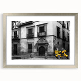 Abstract art print of Andalusian scenery in muted earth tones, framed with a silver mat, ideal for dining room decor.