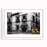 Extra large abstract art print of Andalucia scenery in textured style, with vibrant earth tones, framed in white.