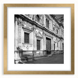 Abstract art print of Barcelona cityscape in gold frame, with muted earth tones, ideal for dining room decor.