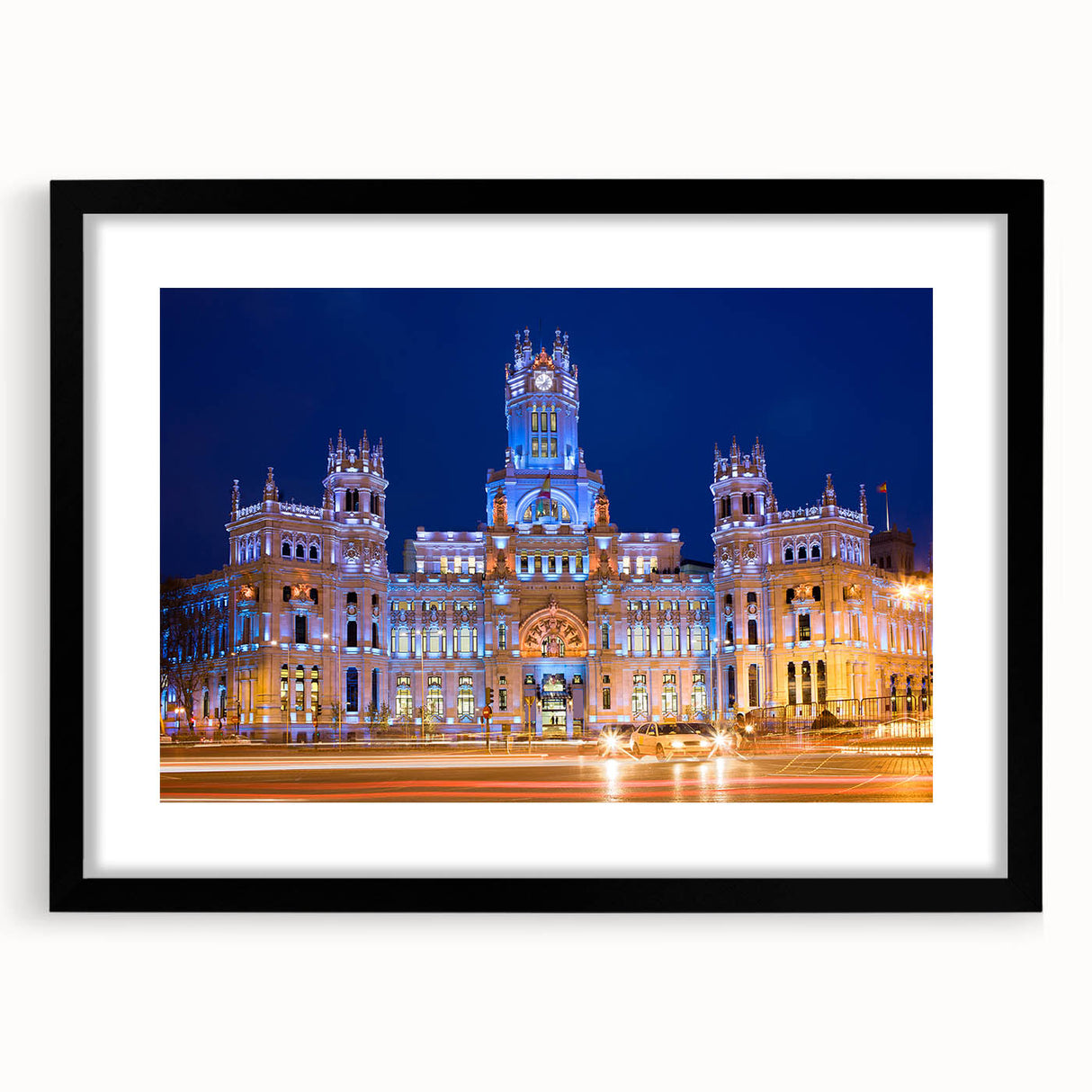 Extra large abstract art print of colorful, textured Madrid scenery on a black framed canvas, ideal for living room decor.
