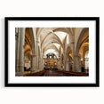 Abstract art print of vibrant, colorful scenery depicting Valencia, Spain, in a large black frame with mat.
