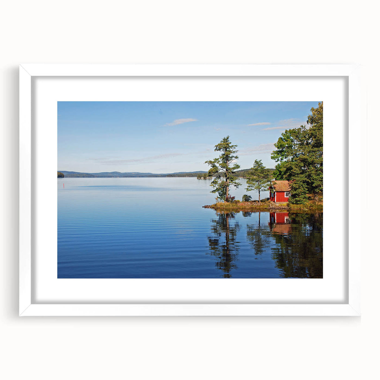Abstract art print of a serene Swedish landscape in muted blue and green tones, framed with a white mat.