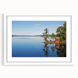Abstract art print of a serene Swedish landscape in muted blue and green tones, framed with a white mat.