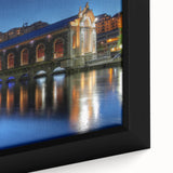 Extra large framed canvas depicting a textured, colorful depiction of Geneva's skyline on a black background.