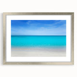 Textured abstract art print of Cancun scenery in muted blue and green tones, framed in silver, ideal for bedroom art.