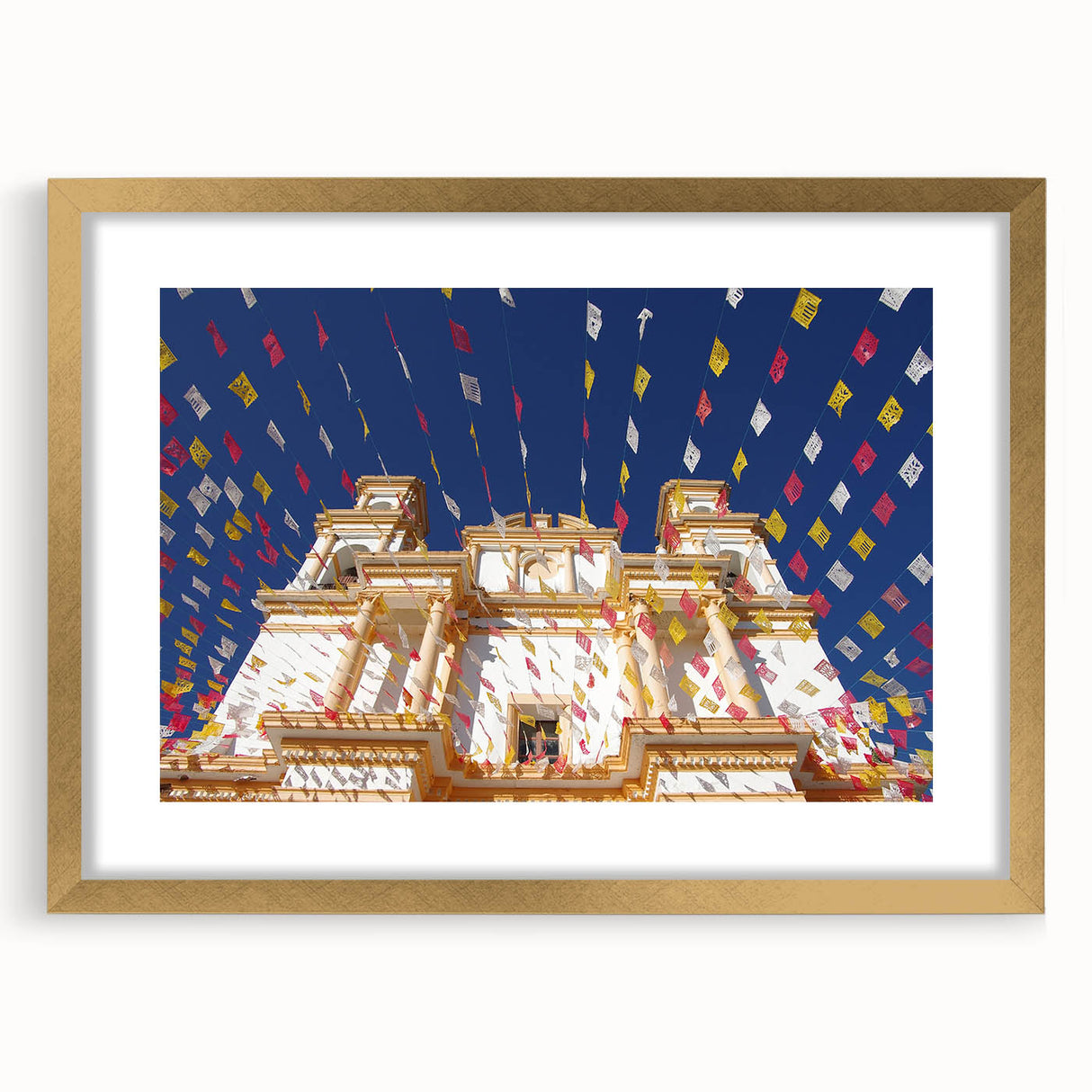 Extra large framed abstract art print of Mexico City with textured brush strokes in gold and earth tones.