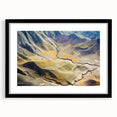 Extra large abstract art print of a colorful, textured Middle Eastern scenery on a black framed canvas.