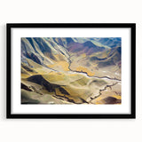 Extra large abstract art print of a colorful, textured Middle Eastern scenery on a black framed canvas.