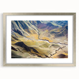 Textured abstract art print depicting a muted Middle Eastern scenery, framed in silver, ideal for bedroom decor.