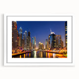 Abstract art print of Dubai skyline in muted gray and blue tones on a white framed poster.