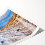 Extra large rolled print featuring line art flowers and a scenic view of the Dead Sea in muted earth tones.