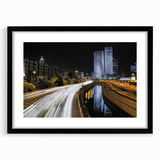 Extra large framed wall art depicting an abstract, colorful Tel Aviv cityscape in vibrant hues on a textured canvas.