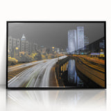 Large abstract wall art featuring a stylized Tel Aviv skyline in muted gray tones, framed in black acrylic.