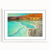 Abstract art print of a Middle Eastern desert scene in muted orange and brown tones on a framed white mat.
