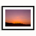 Extra large abstract art print depicting a colorful, textured Middle Eastern landscape on a framed black mat.