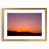 Extra large abstract art print of Middle Eastern scenery in gold frame, featuring textured earth tones.