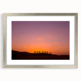 Textured abstract art print of a Middle Eastern scenery in muted earth tones, framed in silver, ideal for bedroom decor.