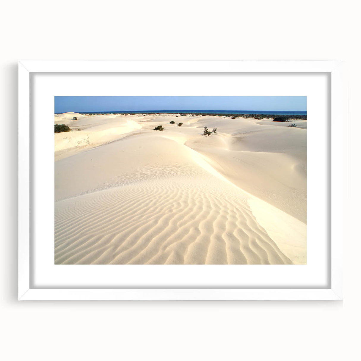 Abstract art print depicting a Middle Eastern landscape in muted earth tones on a framed white canvas.