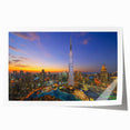 Extra large rolled print of the Burj Khalifa amidst a muted gray cityscape, ideal for art wall dining room.