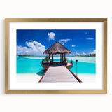 Extra large abstract art print of French Polynesia's oceanic scenery in muted blue tones, framed in gold.
