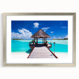 Textured abstract art print of Bora Bora scenery in muted blue and green, framed in silver, suitable for bedroom decor.