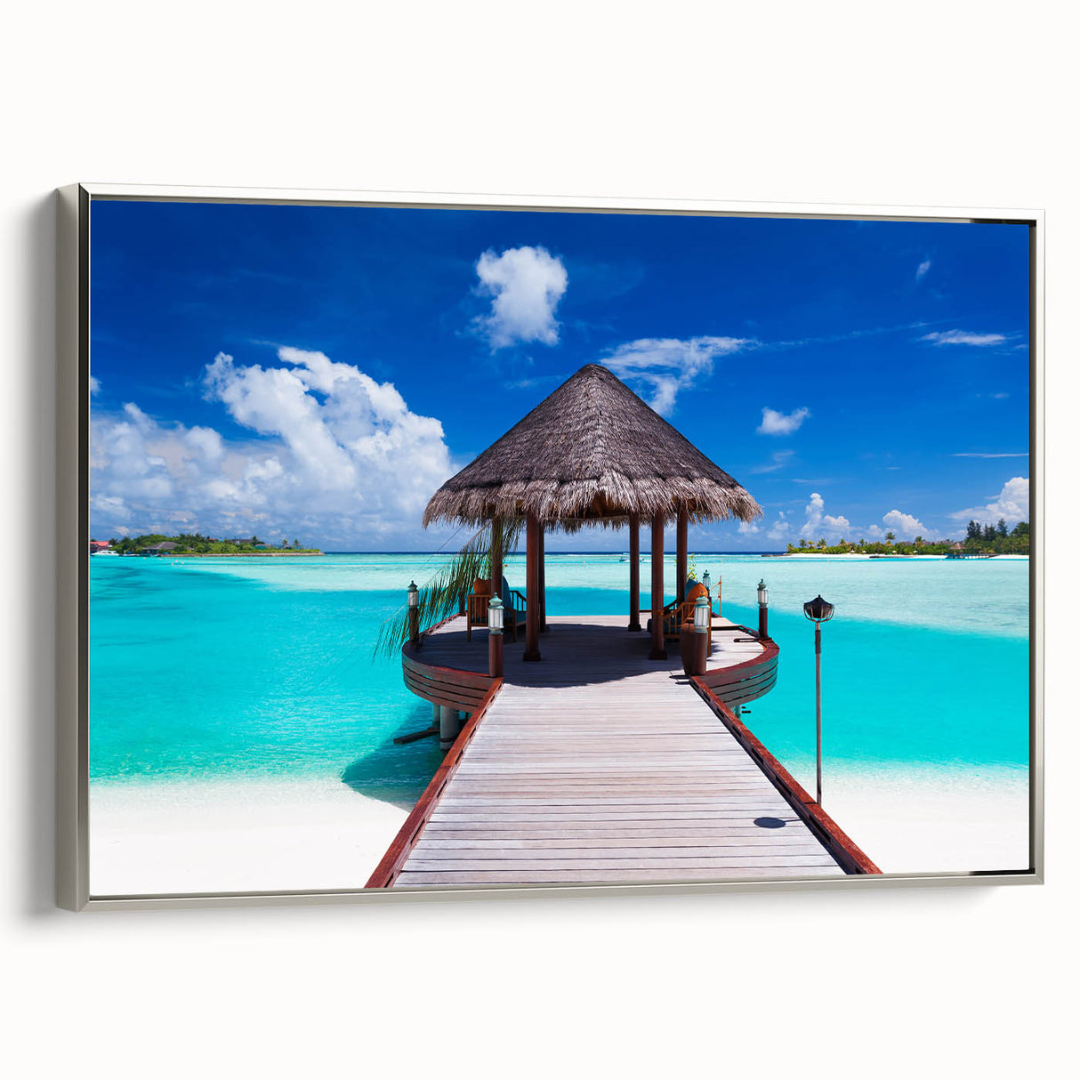 Landscape art painting of Bora Bora with vibrant blue waters and lush greenery on a silver-framed canvas.